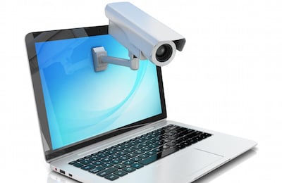 Internet security concept â€“ laptop and surveillance camera ...
