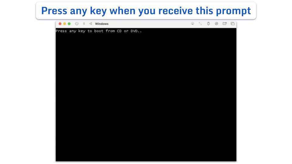 A black terminal window displaying the text: Press any key to boot from CD or DVD.