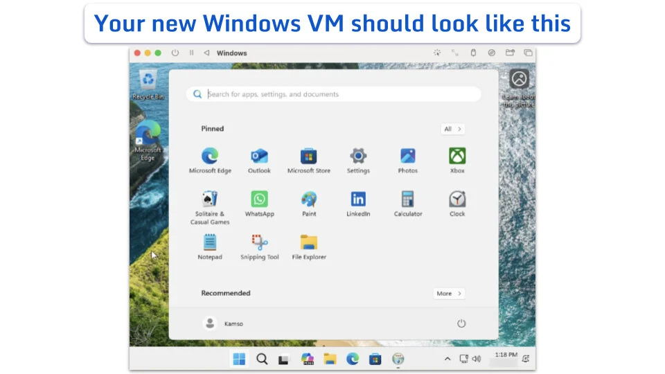 Windows 11 Start menu open on a desktop with a coastal wallpaper.